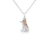 A sterling silver pendant in the shape of a Springer Spaniel dog with rose gold highlights, attached to a silver chain.